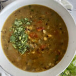 Mixed Lentil Dal Recipe served in a white ceramic bowl garnished with cilantro.