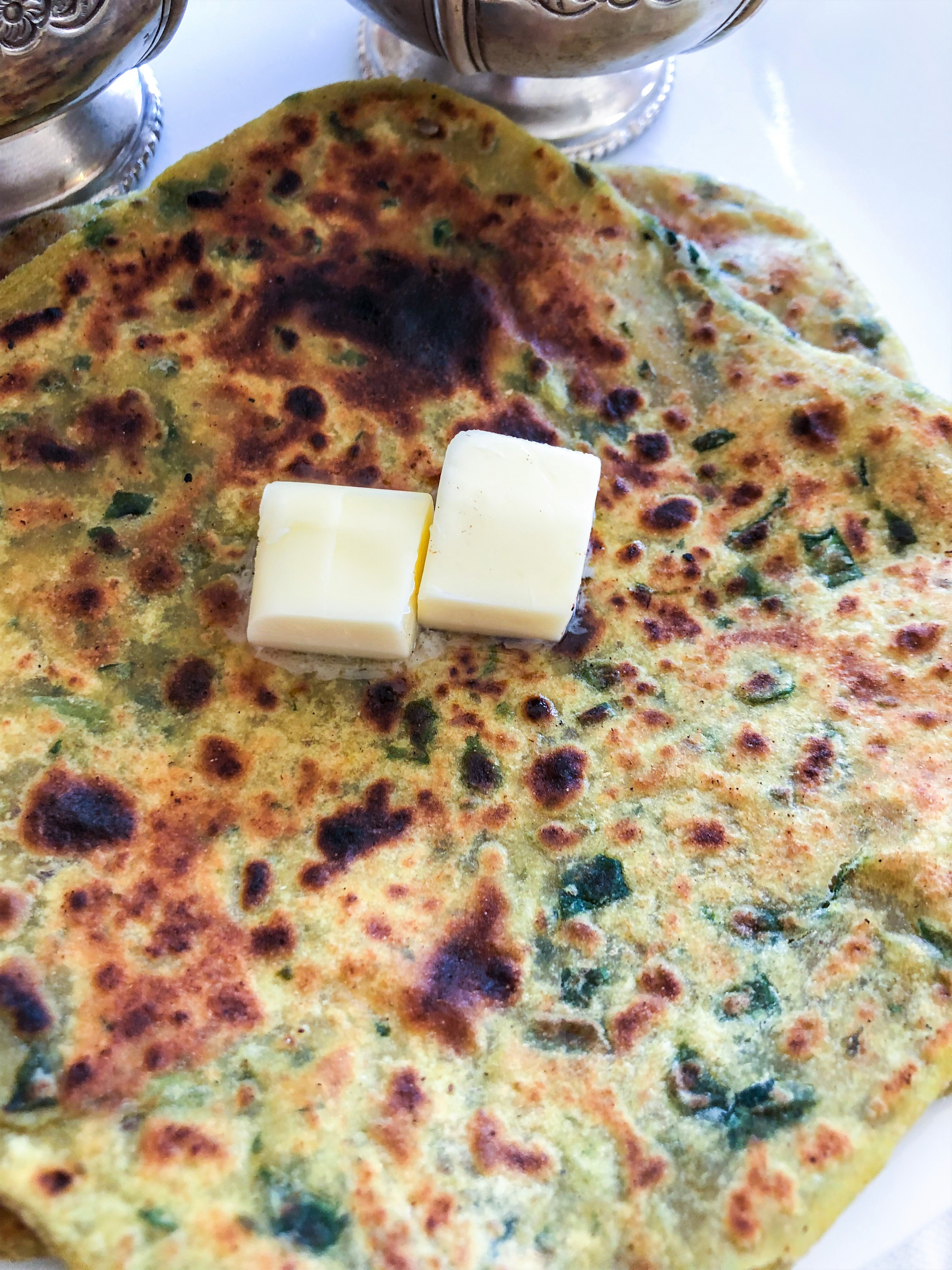 Spinach parantha with two dollops of butter