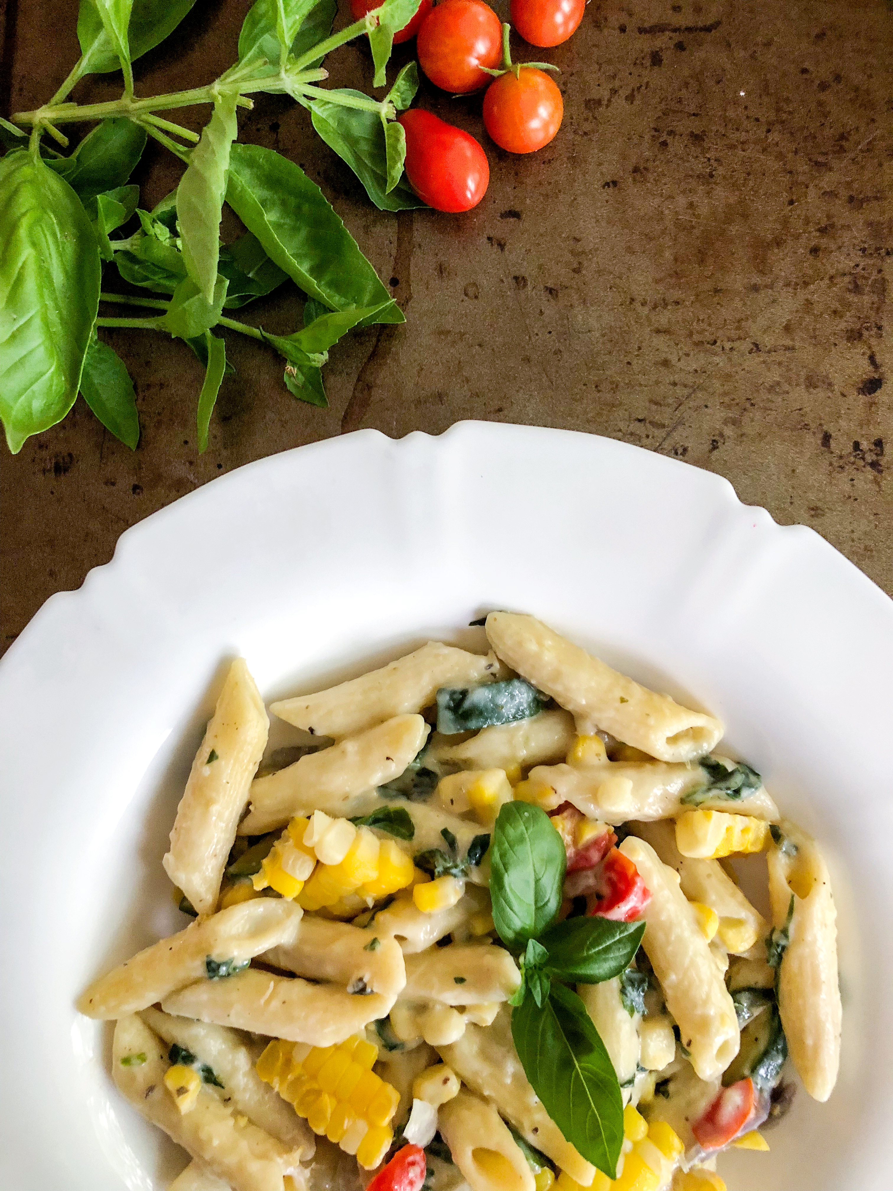 Easy weeknight alfredo pasta with lightened up sauce and summer vegetables
