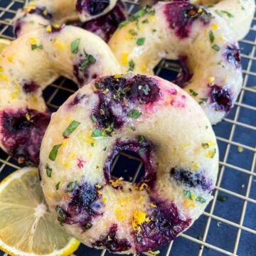 Baked-Lemon-Blueberry-Donuts-with-Lemony-Mint-Glaze_Donut-stack-on-cooling-sheet_FI.jpg