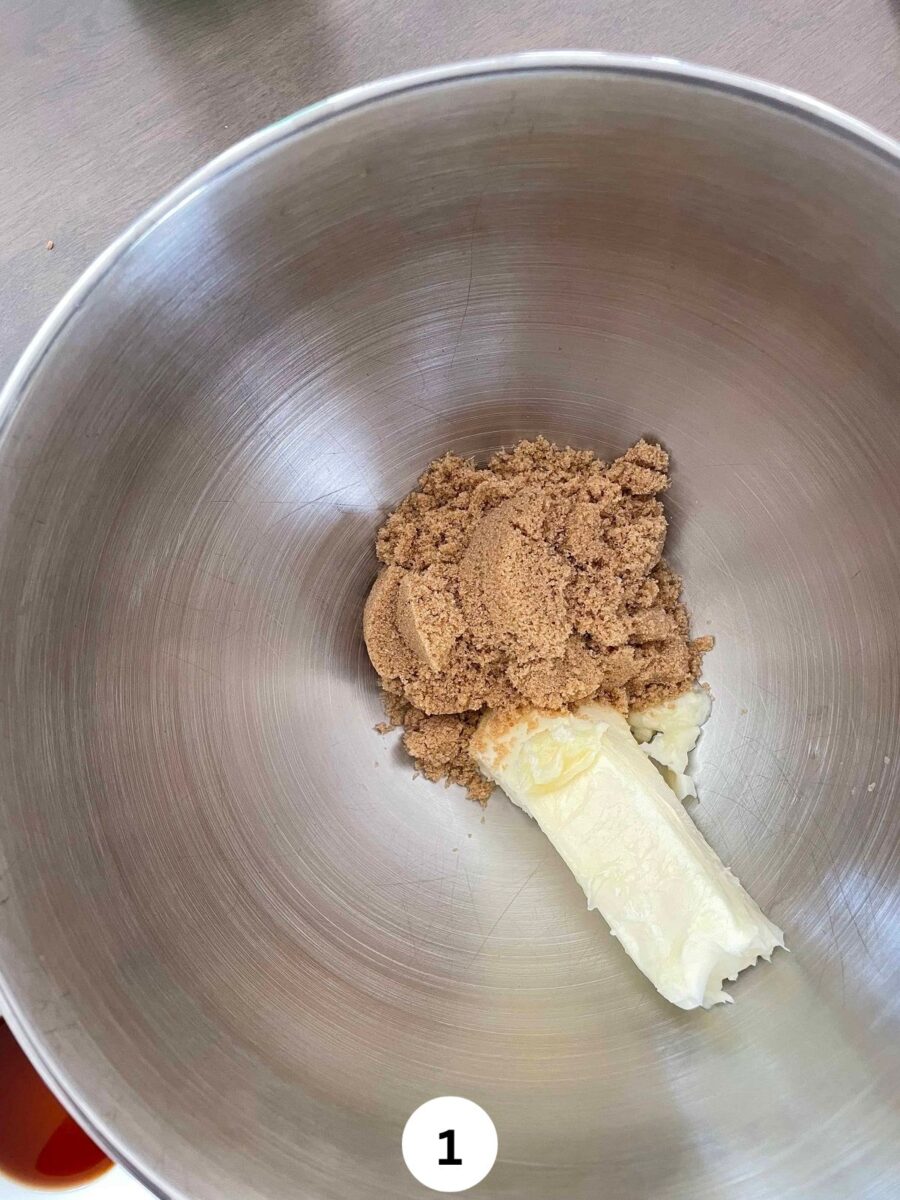 Brown sugar and softened butter in a deep steel mixing bowl.