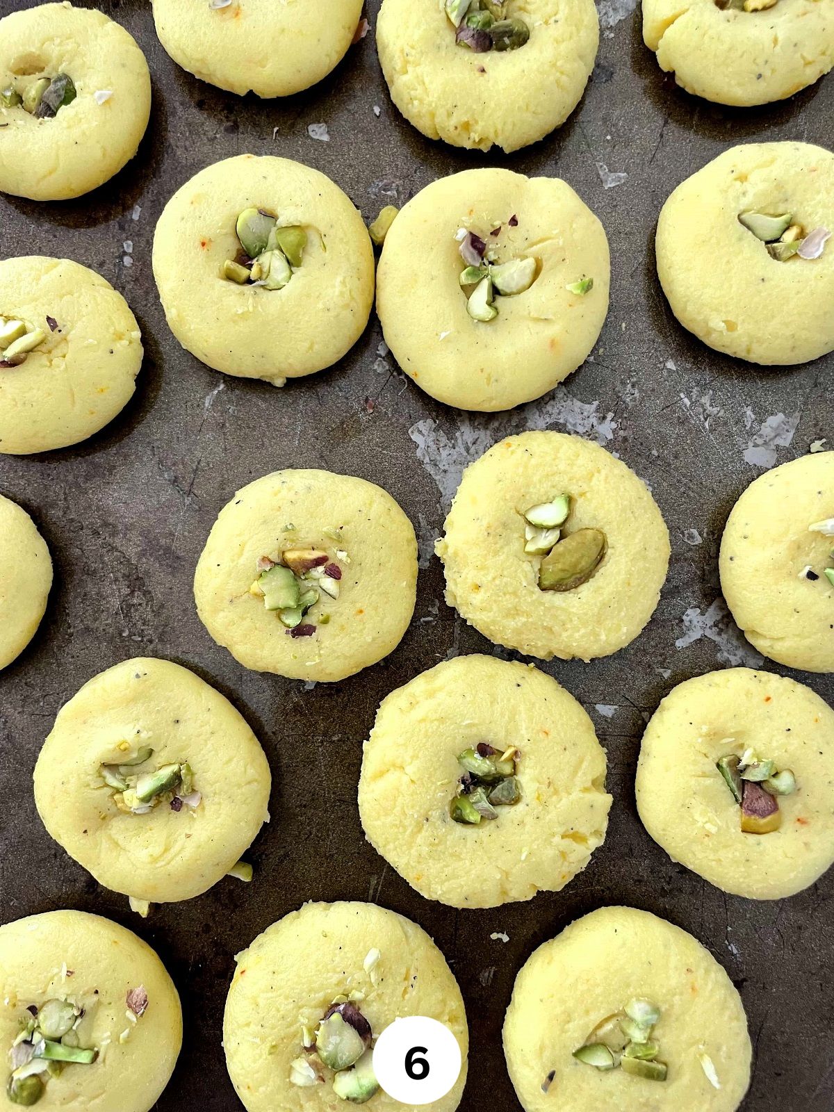 Condensed milk pedas garnished with chopped pistachios.