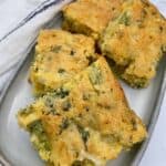 4 slices of Broccoli Cheddar Cornbread on a grey ceramic plate.