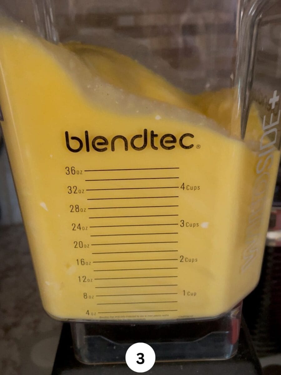 Egg and cheese mixture in a blender jar..