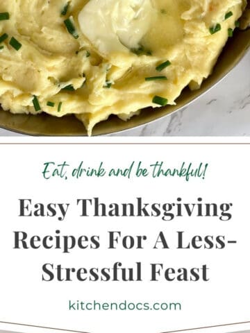 Mashed potatoes topped with butter and chopped green chives in a stainless steel and gold dish on a white background. The image has text saying easy thanksgiving recipes for a less-stressful feast.