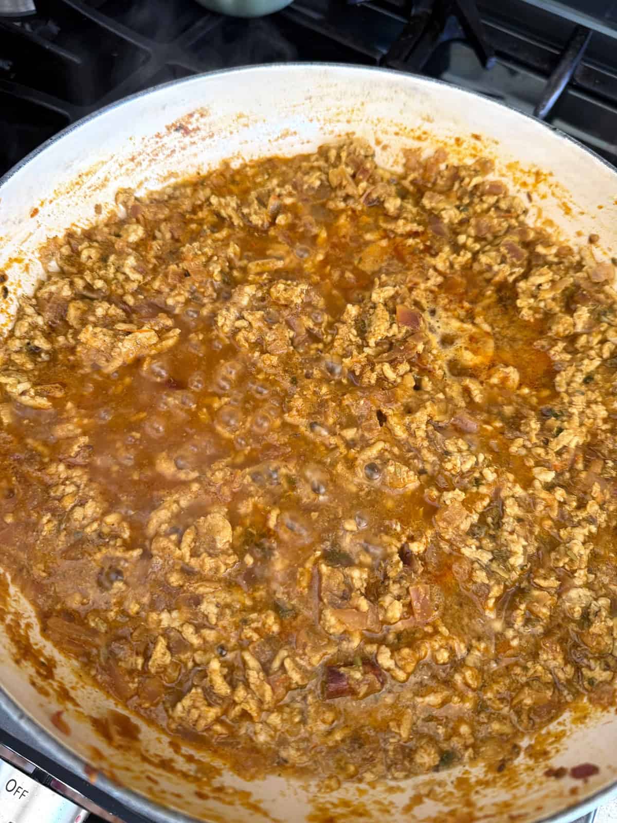 Ground meat curry in a pan.