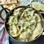 Afghani chicken without cashews with caramelized onions and blistered lemon and green chili slices.