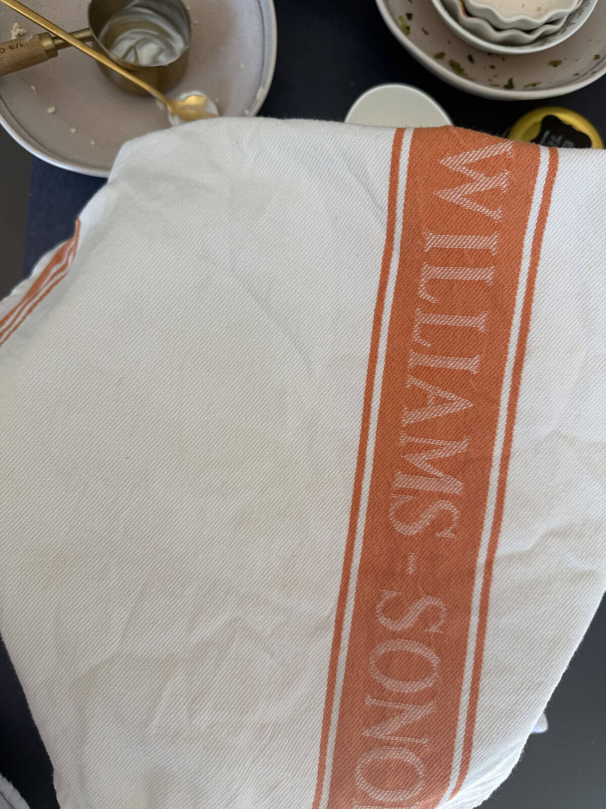 A kitchen towel covering a bowl.
