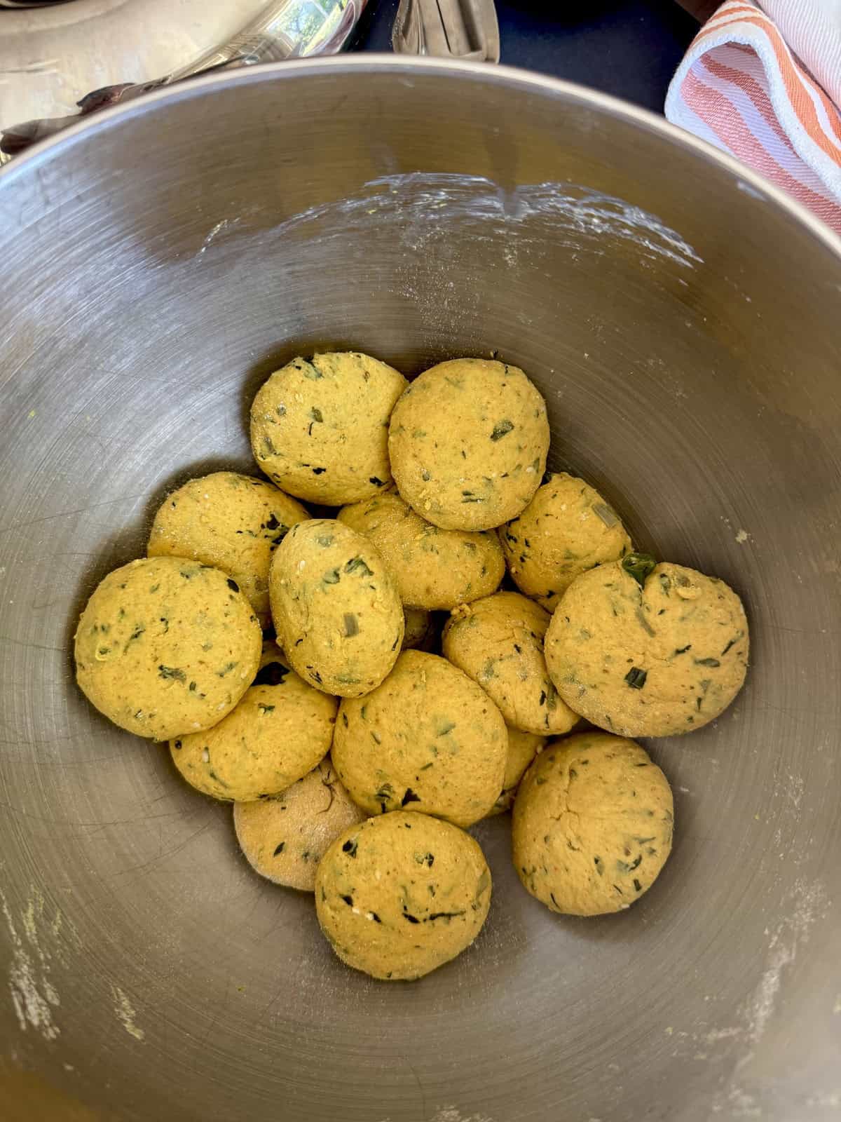 High protein tofu thepla dough balls in a stainless steel bowl.